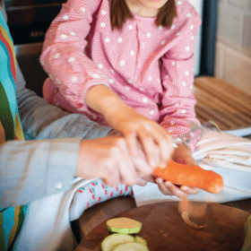 cooking in the kitchen, peeling carrot