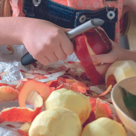 girl peeling apples
